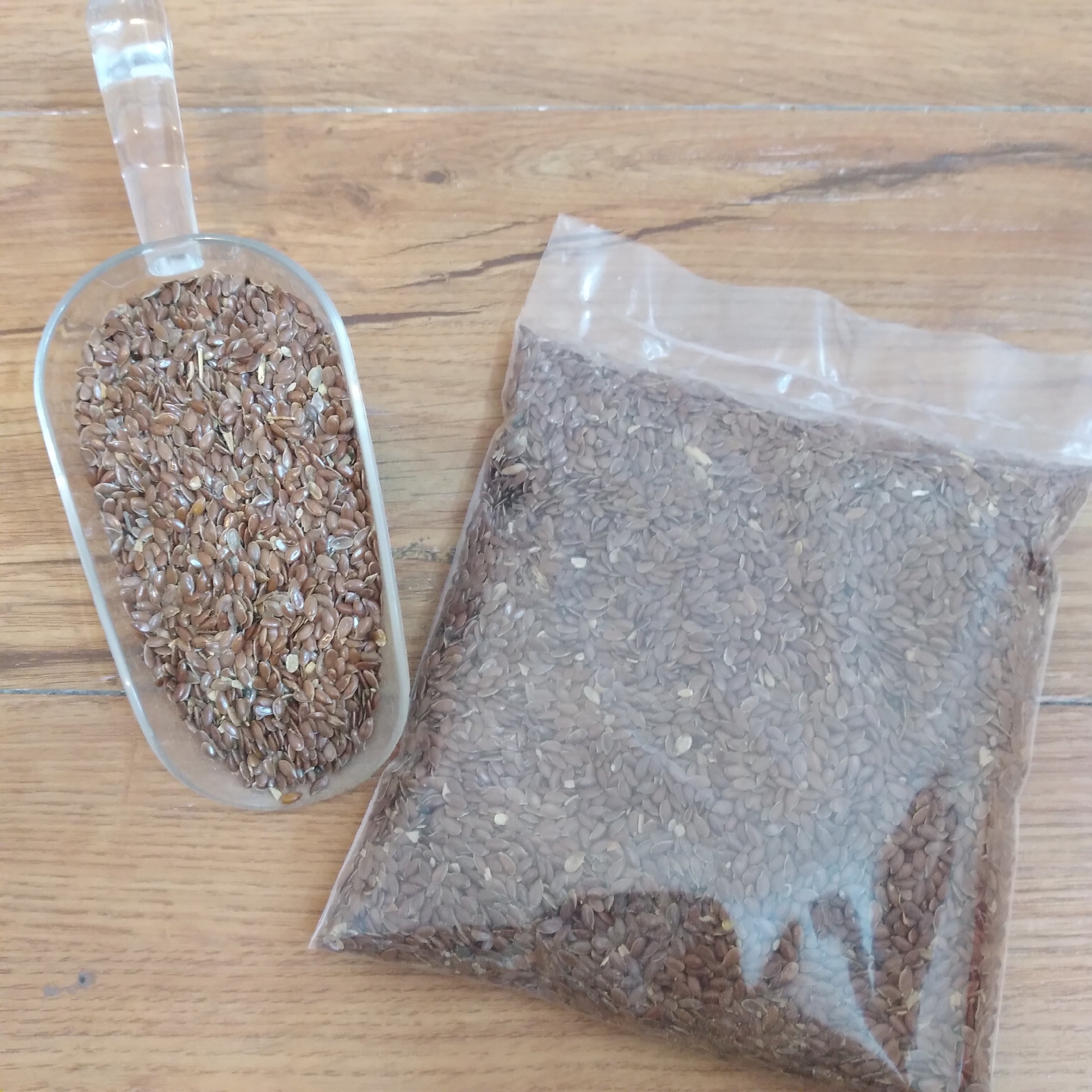 تخم بذرک یا کتان قرمز غذای طوطی و پرنده( بسته 100 گرمی)