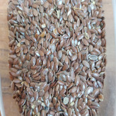 تخم بذرک یا کتان قرمز غذای طوطی و پرنده( بسته 100 گرمی)